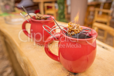 German drink, hot wine and flaming sugar