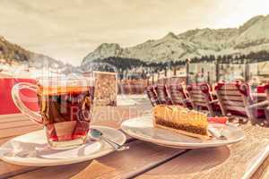 Hot drink and cake at a mountain resort