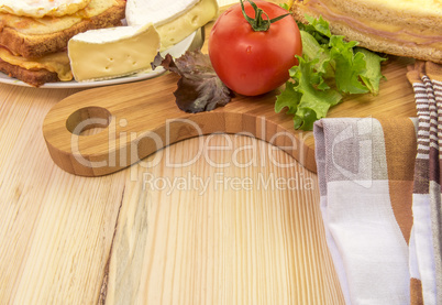 Plate and wooden platter with food