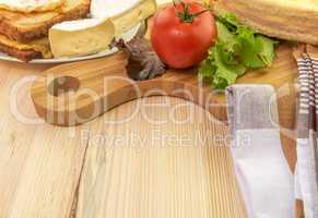 Plate and wooden platter with food