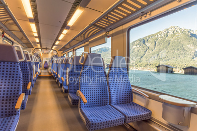 Train chairs and mountain view through the window