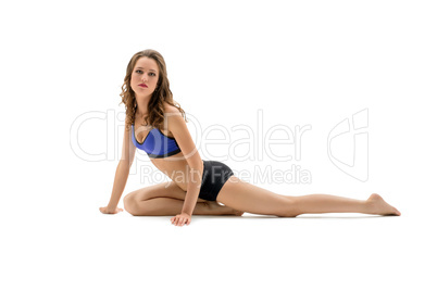 Attractive curly athlete posing looking at camera