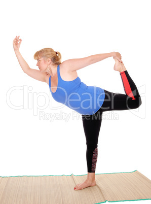 Yoga trainer standing, showing poses.