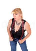 Pretty woman bending with suspenders.