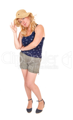 Woman in shorts and straw hat.