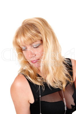 Portrait of blond woman in black dress.