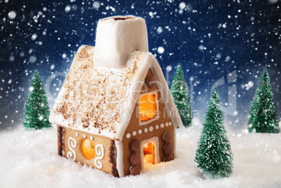 Gingerbread House On Snow With Snowflakes And Blue Background