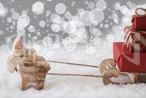 Reindeer With Sled, Silver Bokeh And Stars Background, Copy Space