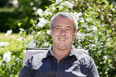 Man sitting on chair in the garden