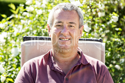 Man sitting on chair in the garden