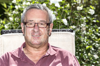 Man sitting on chair in the garden