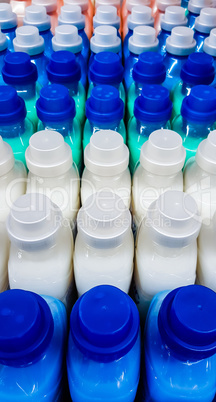 Color plastic bottles in a row.