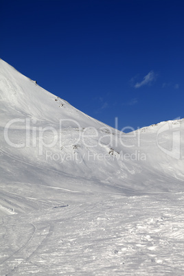 Snowy skiing piste in nice sun day