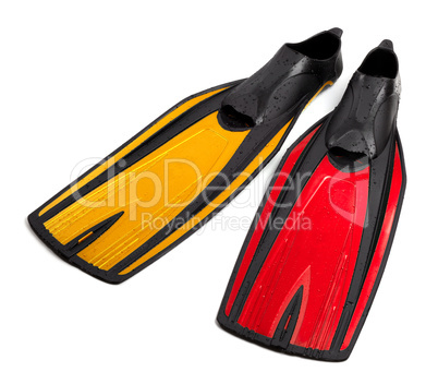 Swim fins of different colors with water drops