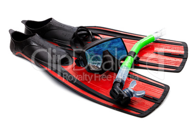Snorkel, flippers and mask with reflection of blue sea