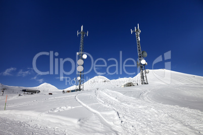 Ratrac ski road and satellite dishes at nice sun day