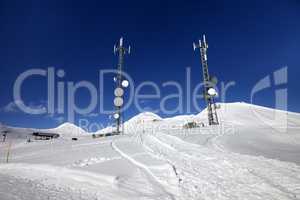 Ratrac ski road and satellite dishes at nice sun day