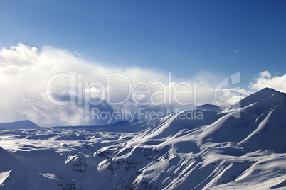 Evening sunlight mountains in cloud