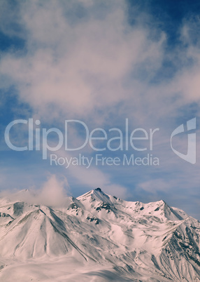 Toned landscape of winter mountains at windy day