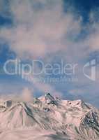 Toned landscape of winter mountains at windy day