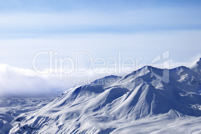 Evening sunlight mountains in cloud