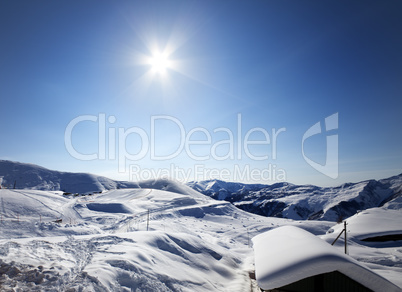 Ski resort and sky with sun