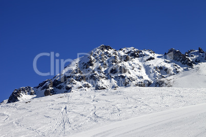Ski slope and snow rocks