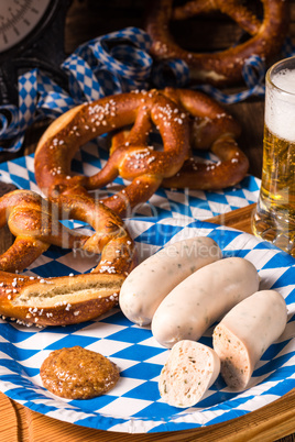 Bavarian sausage with pretzel, sweet mustard and beer