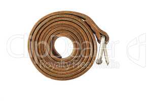 Coiled leather belt on a white background