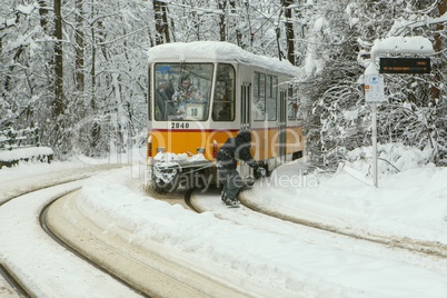 Extreme Snowboard ride behind a tram