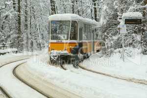 Extreme Snowboard ride behind a tram