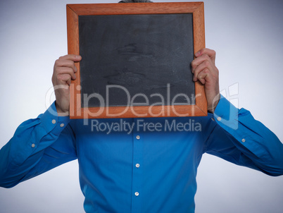 Businessman with a small chalkboard