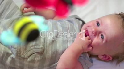 Happy Infant Baby Newborn Child Smiling In Crib Bed Cradle