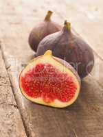 Fresh organic figs on wood