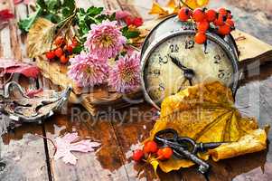 Alarm clock and fallen leaves