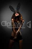 Photo of playful model posing in bunny ears mask