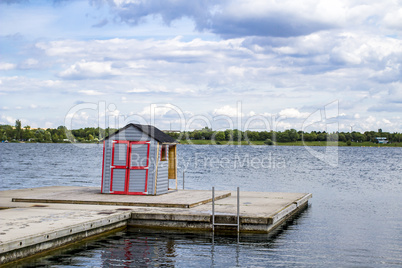 Small house on jetty in the lake