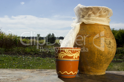 Clay jug with milk