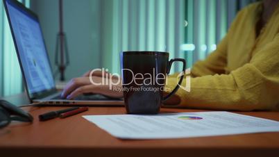 Girl Studying At Night Spilling Coffee On Homework