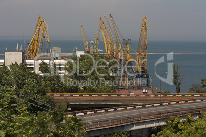 Ship-repair yard. Industrial zone of sea cargo port with grain dryers, containers, cranes and storehouses photo