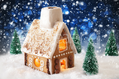 Gingerbread House On Snow, Snowflakes And Bokeh Effect