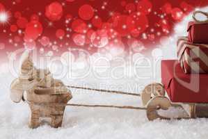 Reindeer With Sled, Christmassy Bokeh And Stars Background, Copy Space