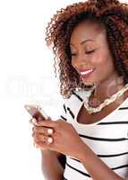 Happy black woman texting.