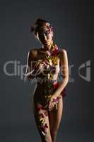Nude girl poses with body decorated butterflies