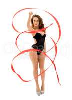 Gorgeous female gymnast dancing with ribbon