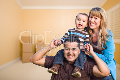 Young Mixed Race Family In Room With Moving Boxes