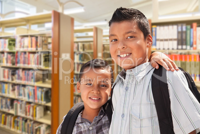 Young Hispanic Student Brothers In Library