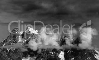 Black and white view on Mt. Ushba in clouds
