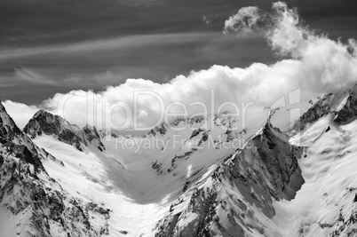 Black and white winter mountains in clouds