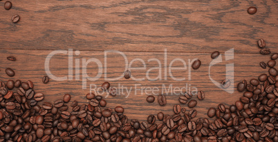 Roasted coffee beans on wood